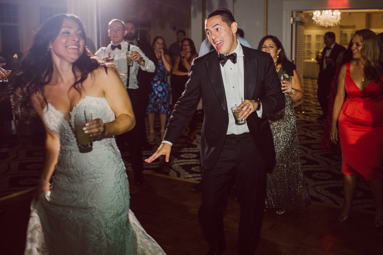 Brianna and Joe perfectly balances each other with their opposite personalities. Brianna quiet and calm and Joe loud and funny, they are the yin and yang to each other and together they create amazing chemistry. Joe's eyes literally sparkles when he is looking at her. Brianna and Joe's summer wedding at Trump National Golf Club Colts Neck NJ this past August was nothing but fun, filled with love and happy tears. Love is all we need in a wedding day! Brianna and Joe got married at ST. Mary’s Church in Colts Neck NJ then partied at Trump National Golf Club Colts Neck NJ. As soon as everyone was inside for the reception, the heavy grey clouds released a down pour washing the humidity away. Leaving cool evening for the newlyweds and their wedding guests to enjoy. Brianna and Joe's wedding at Trump National Golf Club Colts Neck NJ photographed by Karis, NY NJ wedding and elopement photographer Hey Karis.